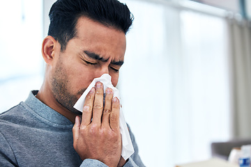 Image showing Blowing nose, sick and man with tissue for allergies, hayfever and sinus problem at home. Healthcare, flu symptoms and male person sneeze with handkerchief for sinusitis infection, virus and illness