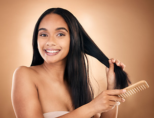 Image showing Hair care, comb and portrait of woman, smile and isolated on a brown background in studio. Salon, face and beauty of model with a product for natural aesthetic, hairdresser and hairstyle for wellness