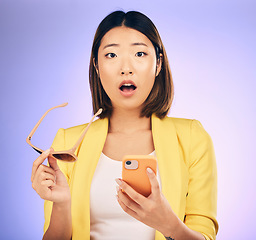 Image showing Phone, asian and portrait of woman surprise for online shopping discount, fashion deal or cellphone announcement. Smartphone notification, studio update or face of shocked person on purple background