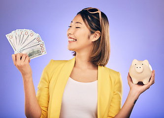 Image showing Piggy bank, money and woman with savings, financial investment and profit, increase or budget success. Excited Asian person with banking notes, cash and safe or container on studio purple background