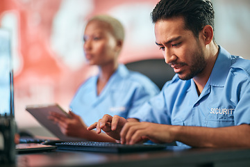 Image showing Man, police and typing on keyboard for communication, alert or surveillance of mall cop at desk. Male person or security guard on computer for monitoring, CCTV or emergency dispatch in crime safety