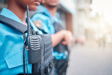 Image showing Radio, police and surveillance with a black woman officer standing outside while on patrol in the city. Walkie talkie, dispatch or communication with a female security guard in an urban town