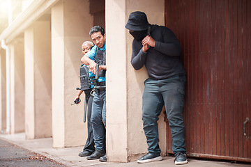 Image showing Police, criminal and gun taking cover for security, backup or law enforcement outside house. Man, woman cop and dangerous robber with weapon in crime for justice, investigation or protection service