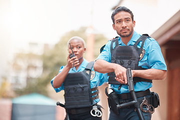 Image showing Crime, team and police with an investigation together for security, law and neighborhood safety. Serious, teamwork and a black woman and a man with gear for search or help during an emergency