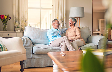 Image showing Couch, love and senior couple relax and laugh together in a home for a conversation and bonding on retirement. Elderly man and woman in a living room for happiness, joke and happy in a marriage