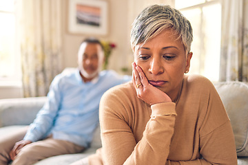 Image showing Sad, conflict and woman with marriage on sofa with thinking in home is depressed or mental health. Fight, divorce and wife is frustrated with mature people in living room, disagreement or problem.