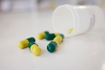 Image showing Pills, medication and capsules of pharmaceutical drugs on table for cure, pain or remedy at the clinic. Closeup of healthcare or medical tablets on desk at pharmacy for products, dose or inventory