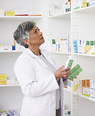 Image showing Senior pharmacist woman, shelf and boxes with thinking, packing stock and inventory inspection. Mature pharmacy manager, package or product for wellness, health or ideas with drugs in retail store