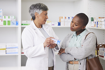 Image showing Pharmacist, women and consulting customer for medicine info, healthcare services and product advice. Pharmacy, client and consultation for box, pills and trust in retail store or pharmaceutical shop