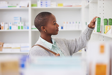 Image showing Medicine, shelf and shopping with black woman in pharmacy for medical, pills and information. Healthcare, product and retail with female customer and box for inventory, wellness and supplements