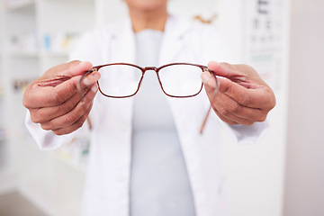 Image showing Glasses in hands, vision and eye care, health with eyesight test and optometry, prescription lens and designer frame. Ophthalmology, focus and healthcare, person in optometrist clinic and eyewear