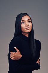 Image showing Indian, woman with beauty and portrait with arms crossed, confidence and mindset with focus, vision or motivation in studio. Serious, calm face and model thinking of idea for fashion on background