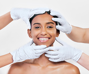 Image showing Woman, plastic surgery and gloves in studio portrait with smile for skin, inspection or change by white background. Girl, model and doctors hands for transformation, cosmetics and facial aesthetic