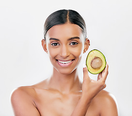 Image showing Facial, avocado and natural beauty, woman with organic cosmetics isolated on white background. Eco friendly skincare, healthy skin glow and female model in portrait, fruit and dermatology in studio