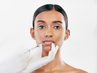 Image showing Lip filler, woman and face with beauty, cosmetic treatment and injection for skincare on white background. Portrait, dermatology and hands with needle, female model and procedure with liquid collagen