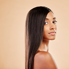 Image showing Woman, portrait and haircare in beauty salon, cosmetics or skincare against a studio background. Female person with long hair posing in relax or satisfaction for keratin spa treatment on mockup space