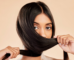 Image showing Hair care, strong and portrait of a woman on a studio background for keratin, shampoo or hairdresser. Salon, health and an Indian girl or model showing hairstyle shine isolated on a backdrop