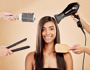 Image showing Hair, electric tools and portrait of woman for beauty options on studio background. Happy indian female model with choice of aesthetic salon equipment with brush, hairdryer and flat iron for makeover