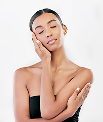 Image showing Hand on face, beauty and a woman with natural skin care isolated on a white background. Dermatology, makeup glow and cosmetics with Indian female model for facial shine and self love in studio