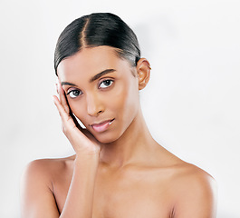 Image showing Beauty, skin and face portrait of a woman with natural glow isolated on a white background. Dermatology, makeup and cosmetics of Indian female model for facial shine, wellness or self care in studio