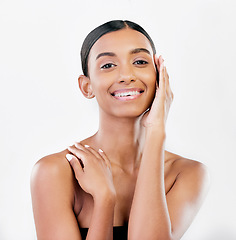 Image showing Beauty, touch and face portrait of a happy woman with natural skin isolated on a white background. Dermatology, makeup and cosmetics of Indian person for facial glow, wellness or self care in studio