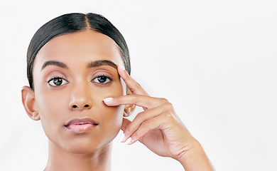 Image showing Beauty, hand on face and portrait of a woman with natural skin glow isolated on a white background. Dermatology, makeup and cosmetics of Indian female model for facial shine or self care in studio
