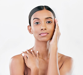 Image showing Beauty, natural and face portrait of a woman with a skincare glow isolated on a white background. Dermatology, makeup and cosmetics of Indian person for facial shine, touch or self care in studio