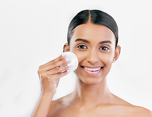 Image showing Woman, face and cotton pad, beauty and makeup remover with skincare isolated on white background. Smile, portrait and dermatology, skin health and glow with young female model and clean facial