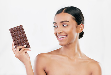 Image showing Happy woman, chocolate and sweet candy for diet or unhealthy food against a white studio background. Female person or model with cocoa slab, block or bar for delicious snack or diabetes on mockup