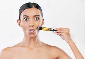 Image showing Portrait, funny and woman with makeup, brush and dermatology against a white studio background. Face, female person and model with cosmetics tool, humor and luxury with wellness, facial and skincare