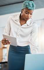 Image showing Black woman, business and working on laptop, tablet and research online website in law firm. Attorney, lawyer and serious female employee search on digital technology, computer and legal data report