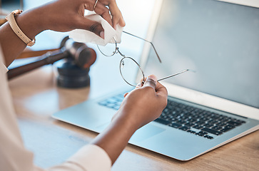 Image showing Hands, glasses and cloth for cleaning in office for dust, dirt removal and clear vision with laptop mockup space in law firm. Eyewear, lens and person with fabric to wipe spectacles for maintenance.