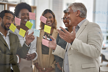 Image showing Meeting, planning and glass with a senior man leading a presentation in a boardroom for company strategy. Teamwork, presentation and sticky notes in an office with a male manager talking to staff