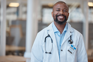 Image showing Doctor, portrait and smile with black man at hospital or lab coat with confidence or leader. Healthcare professional, happy and face with manager or positive mindset at clinic with vision or expert.