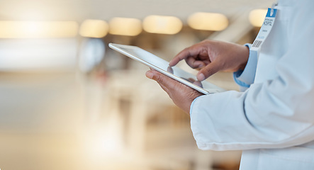 Image showing Digital tablet, closeup and hands of a doctor browsing while doing medical research for a diagnosis. Healthcare, technology and professional male surgeon analyzing medicare data in hospital or clinic