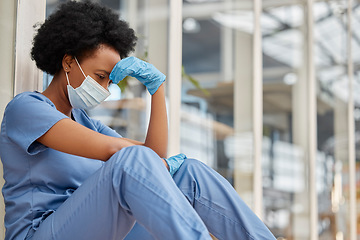 Image showing Surgeon mental health, crying and black woman depressed about clinic news, hospital crisis or nurse mistake. Doctor, frustrated or African female nurse sad about healthcare risk, pain or sit on floor