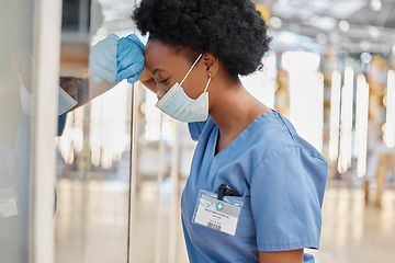 Image showing Surgeon pain, depressed or black woman tired after medicine fail, hospital crisis or nurse mistake. Doctor, burnout or African female nurse overwhelmed with medical risk, anxiety or leaning on window