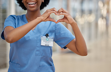 Image showing Woman, nurse and heart hands for love, healthcare or passion in cardiology at the hospital. Hand of happy female person or medical professional show loving emoji, symbol or shape icon at the clinic