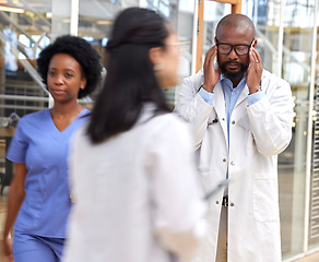 Image showing Doctor headache, mental health problem or black man frustrated with service fail, hospital accident or crisis. Depressed, migraine or African person burnout from medical mistake, stress or healthcare