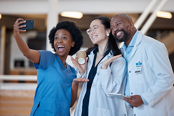 Image showing Diversity, happy and group selfie of doctors, surgeon or emergency care workforce in hospital, clinic or medical facility. Asian woman, black woman nurse and African man smile for healthcare photo