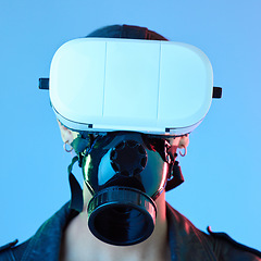 Image showing Woman, vr glasses and face mask in studio for user experience, gaming or 4d movie by blue background. Girl, augmented reality and tech for gas, scent and video with app, digital world and fantasy ux