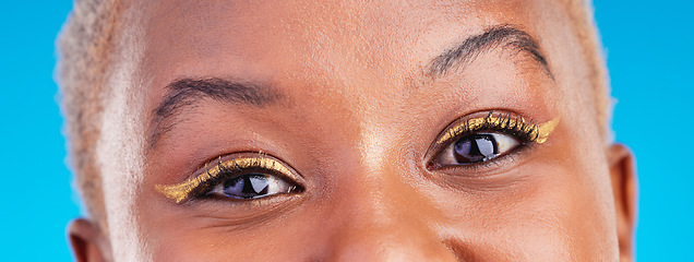 Image showing Makeup portrait, eyeliner and eyes of black woman with studio beauty, wellness and facial cosmetics for skincare shine. Mascara, cosmetology design and closeup African person on blue background.