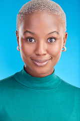 Image showing Portrait, cosmetics and black woman with confidence, smile or pride in blue studio background. Beauty, face and african female with makeup and positive mindset for fashion for wellness or glow.