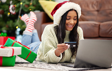 Image showing Christmas, online shopping and woman with laptop, credit card for payment for gift with internet banking. Female customer, smile for holiday donation and ecommerce for present, fintech and bank app