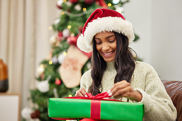 Image showing Woman, Christmas and open present with smile, celebrate holiday with happiness and wrapped box with ribbon. Special event, female person at home with gift giving and package, festive and xmas