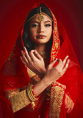 Image showing Fashion, culture and portrait of Indian woman with hand sign in traditional clothes, jewellery and sari veil. Religion, beauty and female person on red background with accessory, cosmetics and makeup