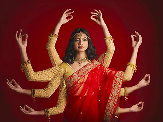 Image showing Indian woman, portrait and goddess with many hands in studio background with sari and jewellery. Mudra, girl and beauty face with meditation with dress or movement with culture or spirituality.