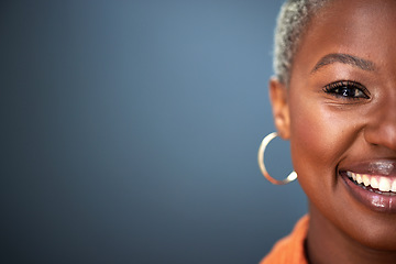 Image showing Mockup, smile and half portrait of black woman in studio with space against grey background. Happy, face and eye of African female person with positive attitude, good mood or laugh on isolated banner