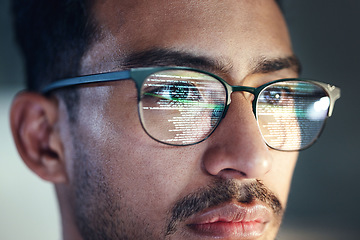 Image showing Glasses, man and reflection of programmer on computer working on software, code and data. IT, engineer and serious face of developer with information technology for cloud computing in office closeup.