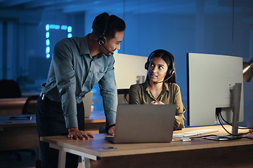 Image showing Business people, call center and laptop at night in customer service or tech support at the office. Businessman and woman working late together for virtual assistant, consultant or agent at workplace